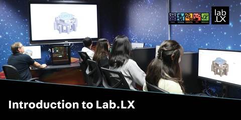 Students sitting in different computer desk in a lab.