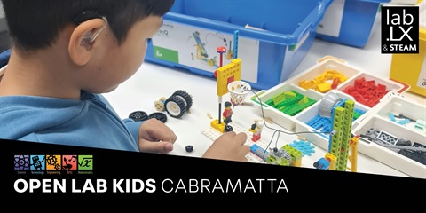A young kid exploring science and technology at an open lab in Cabramatta, promoting innovation and curiosity.